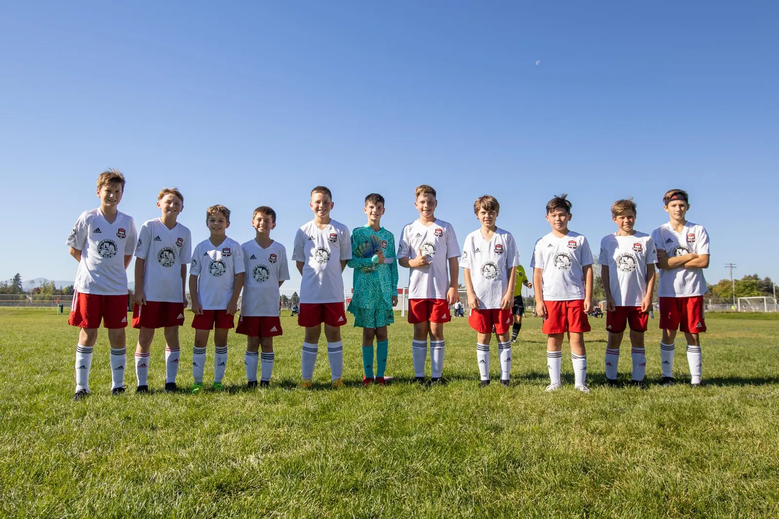 A Sting Soccer Club youth team lined up on the field